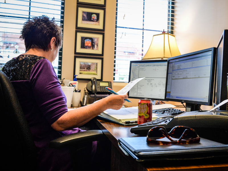 Woman at desk working on business accounting